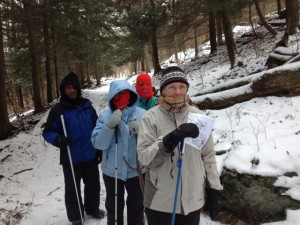 In photo. While it appears that Pat is leading the hike, she is only holding map while Ed snaps the photo. End photo.