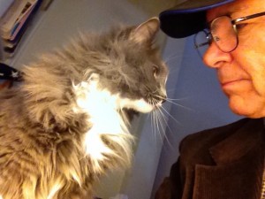 In photo. Wednesday and new tall-staff are in the computer corner. Wednesday is in front of the keyboard blocking new tall-staff from typing. Wednesday appears to be talking face-to-face with new tall-staff. End photo.