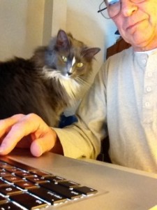 In photo. Tall new-staff and Wednesday are side by side while tall new-staff types on the computer keyboard. End photo.