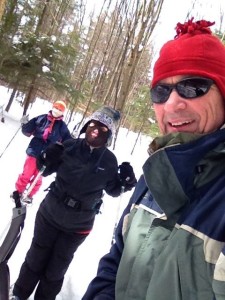 Photo shows Ed, Esther, and Marilee snowshoeing single file along the low trail.