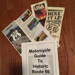 In photo. Maps and tour guide books are shown together indicating the level effort and detailed planning. End photo.