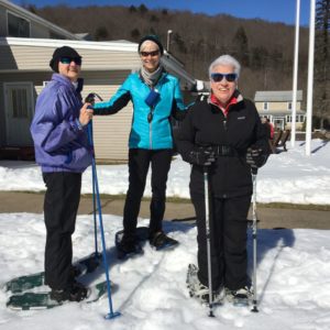 In photo is shown Linda, Joanne, and Esther. They snowshoed up the mountain behind the lodge.