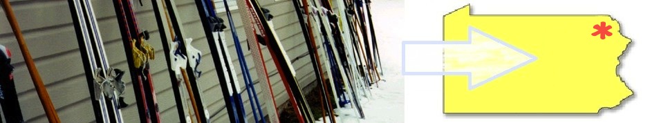 On the left of the picture are skinny skis leaning on an outside wall with snow visible on the ground. On the extreme right is an outline of the state of Pennsylvania. Between the two exremes is an arrow pointing to a small star in the corner of the state. The star indicates where the 2014 regional event will take place.