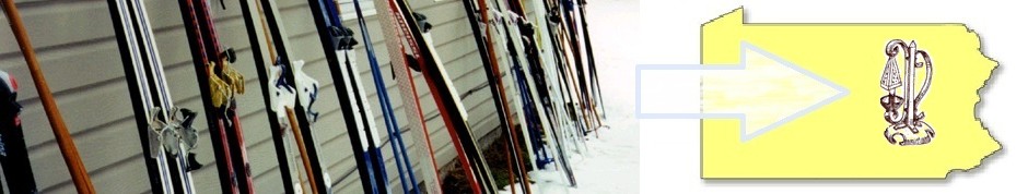 On the left of the picture are skinny skis leaning on an outside wall with snow visible on the ground. On the extreme right is an outline of the state of Pennsylvania. Between the two extremes is an arrow pointing to the lamp logo of the Inn at Starlight Lake.